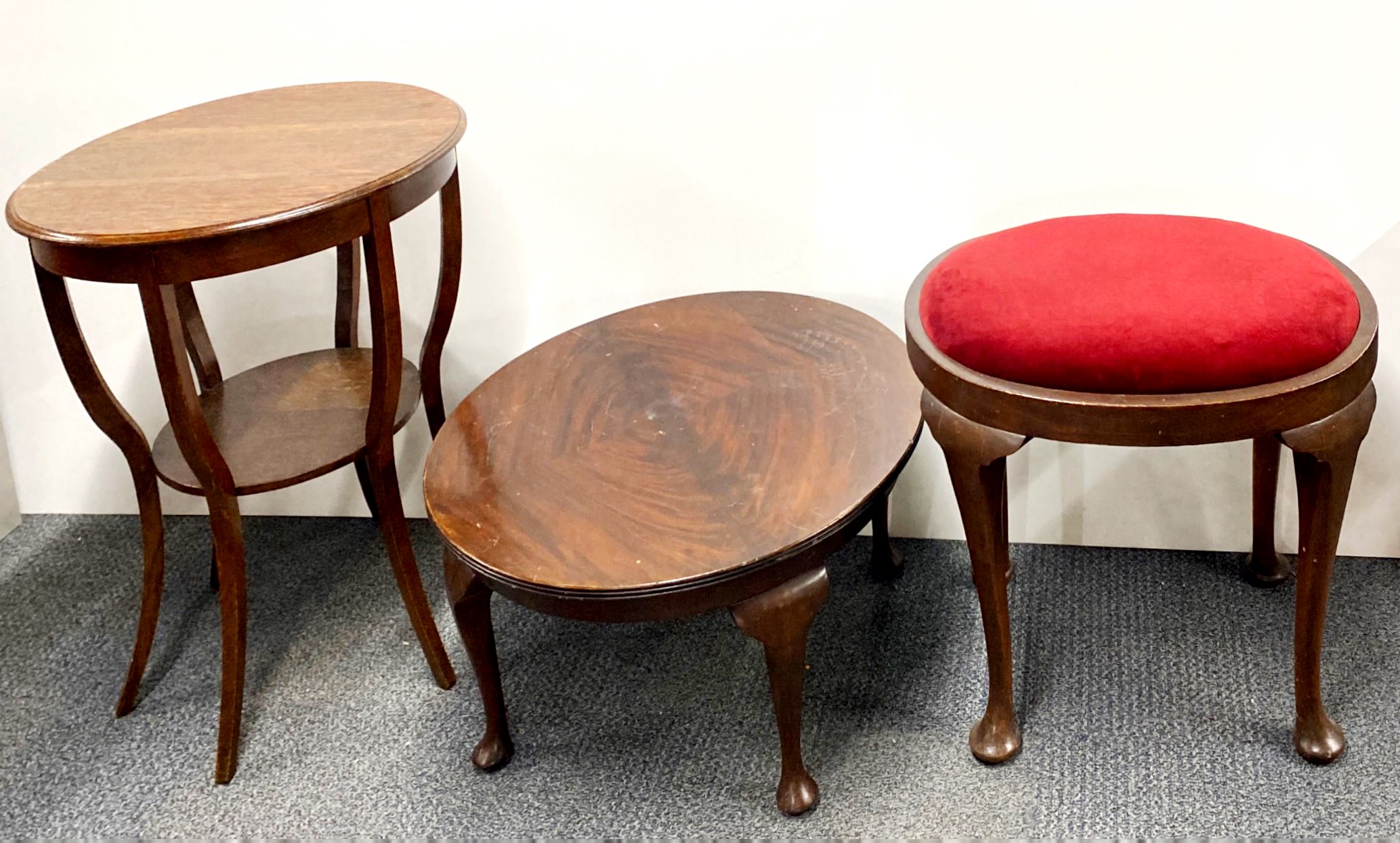 A mahogany dressing table stool and two circular side tables.
