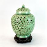 A Chinese Celadon glazed pierced pottery vase and cover mounted as a lamp, H. 29cm. Slight crack