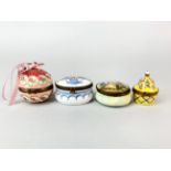 Four enamelled and porcelain pill boxes, largest 6cm.