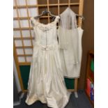 A vintage cream silk wedding dress with a 1960's wedding/bridesmaids dress.