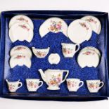 A boxed child's vintage tea set.