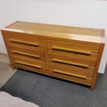 A heavy, light oak six drawer sideboard, 153 x 85 x 45cm.