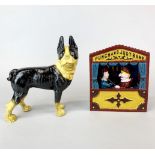 A reproduction cast iron Punch and Judy money box bank, H. 18cm, together with a cast iron dog