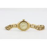 A lady's hallmarked 9ct yellow gold Pioneer wrist watch, L. 20cm.