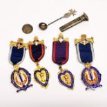 Two silver gilt Oddfellow medals with two further gilt medals, a lapel posy holder, a spoon and worn