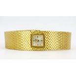 A boxed lady's Zenith 18ct gold wrist watch, L. 18cm.