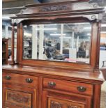 A 20th C carved mahogany mirror backed sideboard, L. 137cm D. 42cm H. 186cm.