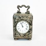 A lovely hallmarked silver antique miniature clock, H. 9cm. Not in working order.