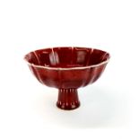 A Chinese sang de boeuf porcelain stem cup, H. 10cm, Dia. 16cm.