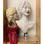 A modelled head bust in the fashion of Marylin Monroe on a perspex and metal plinth, together with a