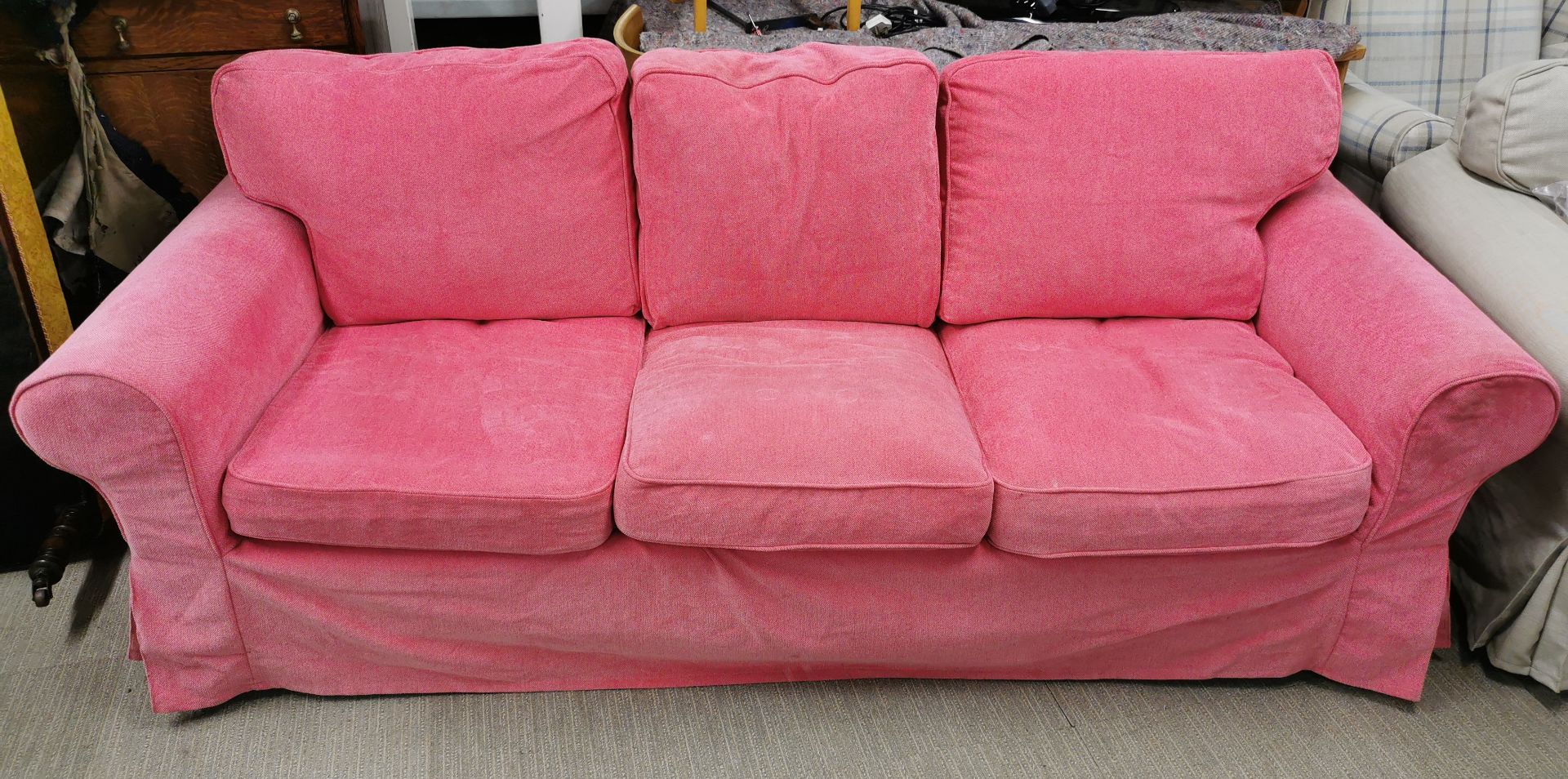 A three seater settee together with a matching two seater settee, with an extra cover to match the