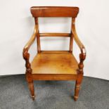 An early 20th C bar-back elbow chair, H. 95cm.