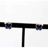 A pair of 18ct yellow gold earrings set with blue stones, L. 0.8cm.