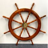 A large wooden ships wheel, Dia. 108cm.