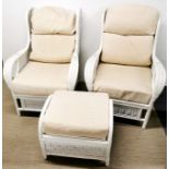 A pair of white painted wicker and cane armchairs with cream cushions together with a matching