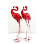A pair of painted metal garden flamingos, H. 63cm.