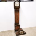 A 20th C carved oak cased granddaughter clock together with an oak cased Napoleon hat mantel