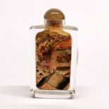 A Chinese inside painted crystal snuff bottle with agate stopper, H. 8.5cm