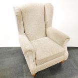 A heavy quality wing back armchair, H. 109cm.