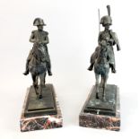 A pair of bronze soldier figures on marble bases, H. 37cm, slight damage to reigns on one figure.