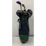 A set of Accura golf clubs and golf bag.