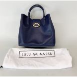 A Lulu Guinness navy blue leather handbag, H. 36cm.