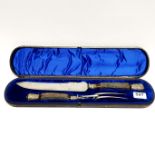 A cased hallmarked silver mounted carving set, case L. 47cm.