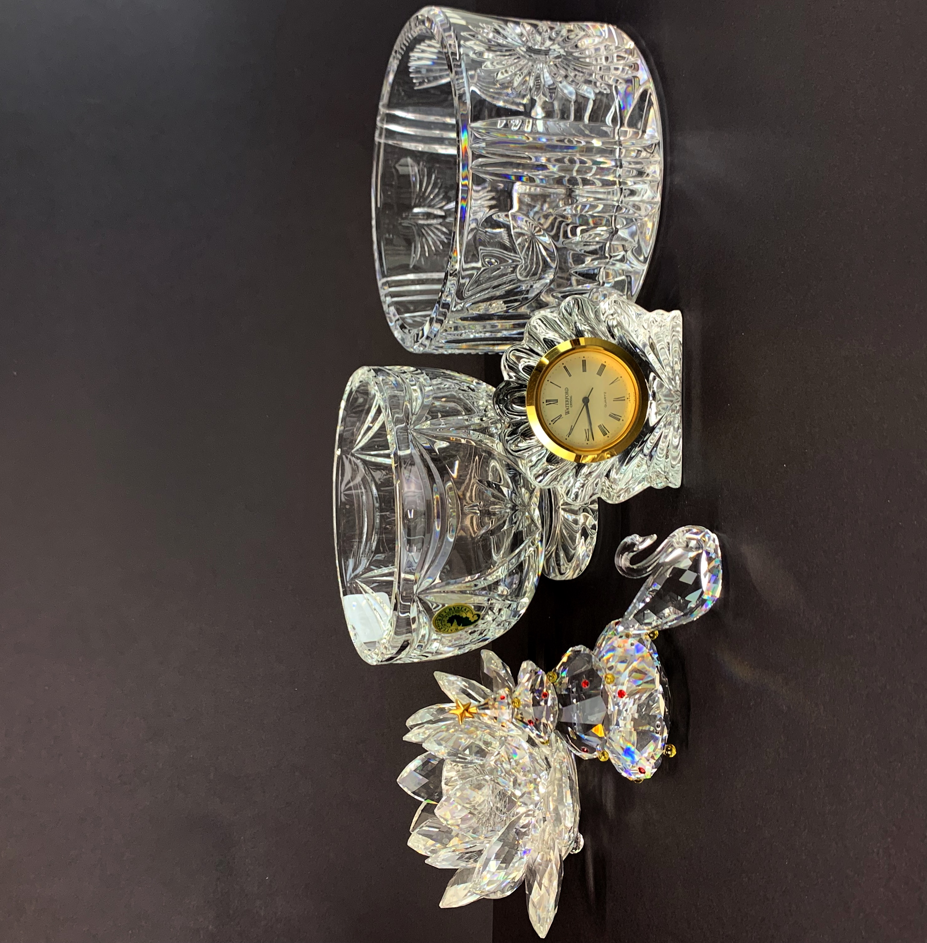 A quantity of Waterford and Swarovski glass items, with some boxes, tallest 9.5cm.