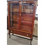 A mahogany three shelf display cabinet with a single bottom drawer, 139 x 93cm.