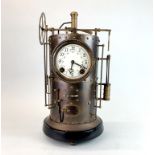 An unusual bronze industrial style mantle clock, H. 41cm.