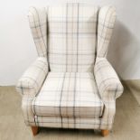 A heavy quality wing back armchair, H. 120cm.