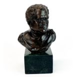 A bronze bust of a Roman emperor on a marble base, H. 15cm.