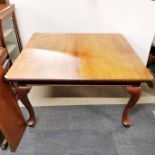 A 20th C extendable wind-out dining table with two additional leaves, table without leaves 130 x