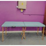 A cased massage table, cased 92 x 62cm.