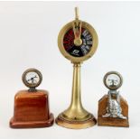 A reproduction brass ship's telegraph together with two mounted early motorcar temperature gauges,