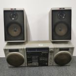 A Philips portable stereo with a pair of Aiwa speakers.