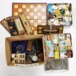 A box of mixed games and matchboxes.