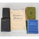 A group of mixed antique bibles and books.