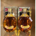 Two bottles of vintage Dimple scotch whiskey.