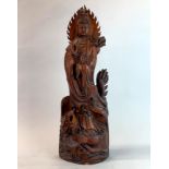 A large Chinese carved wooden figure of Guanyin, H. 57cm. Very slight damage to base.