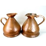 Two 4 gallon copper jugs; C. Mackinlay & Co London, and JA Stewart & Co, H. 39cm.