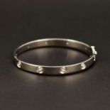 A heavy 9ct white gold diamond set bangle, dia. 6 x 5cm.