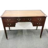 A four drawer leather topped writing desk on castors H. 78cm, L. 14cm.