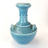 A lovely Chinese pale blue glazed porcelain vase with three handles, H. 41cm.