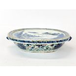 A small 19th century Chinese porcelain hot water heated serving plate, W. 21cm, H. 5cm. Slight