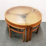 A Nathan teak and glass trinity coffee table. H. 51cm Dia. 81cm.