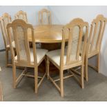 A handmade circular light oak pedestal dining table with extension leaf, dia. 136, leaf W. 65cm,