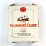 A boxed set of three Fisherman's Friend diecast model vehicles.