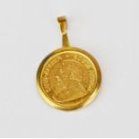 A 1988 1/10th krugerrand in a 9ct gold pendant mount.