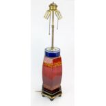 An interesting mid 20th century Chinese lacquered wood and porcelain table lamp, H. 70cm.